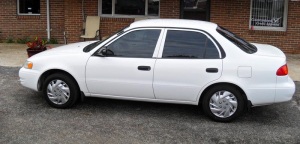 This is not my car. This one's quite a bit nicer. (from http://marlin-car.com/1998-toyota-corolla-white)